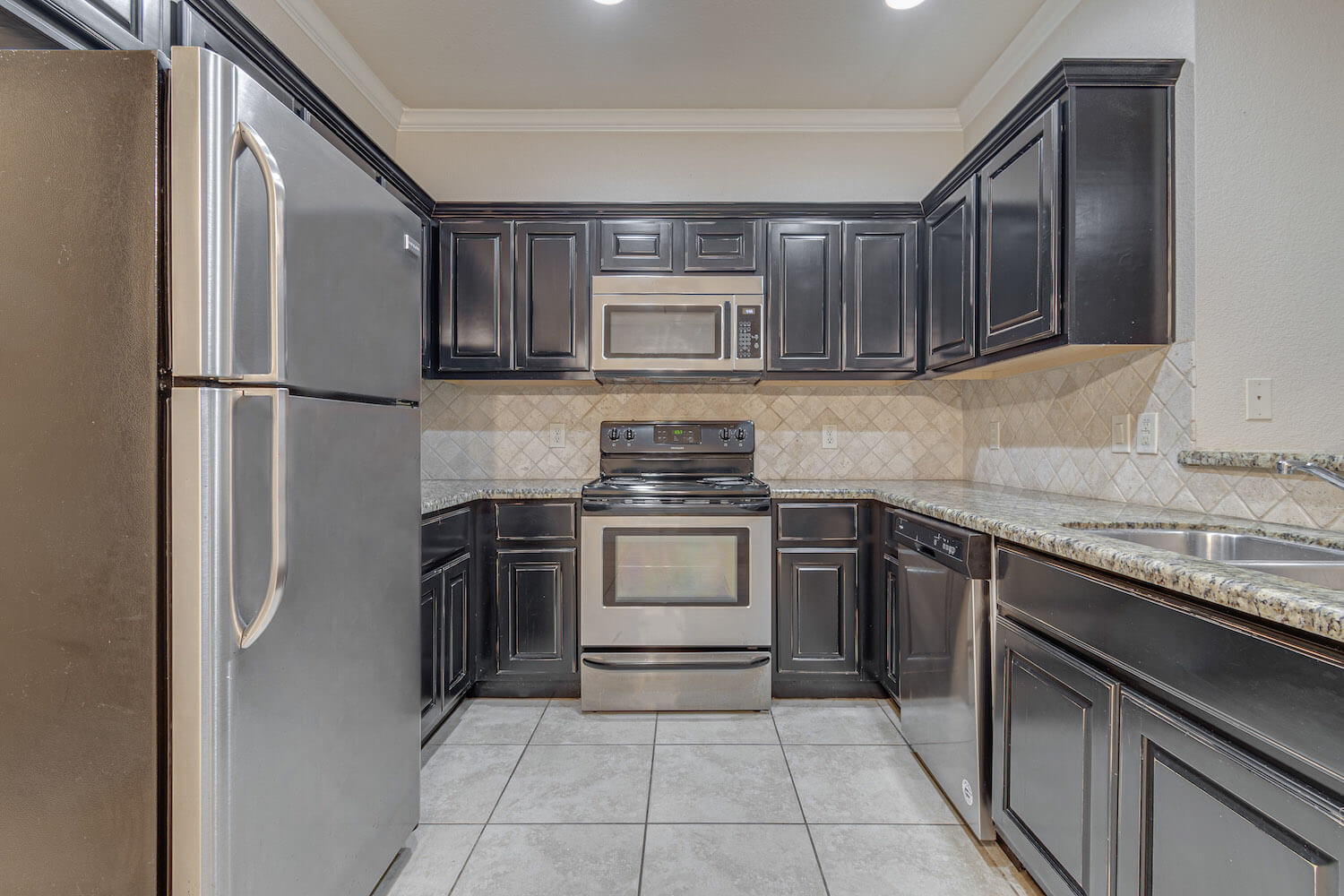 A modern kitchen with stainless steel appliances.