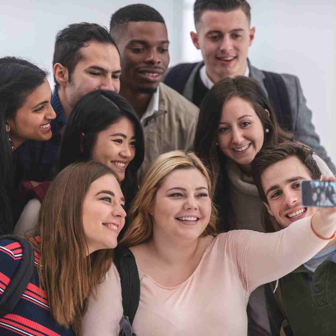 A group of young friends takes a selfie.